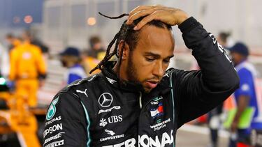 (FILES) In this file photo taken on November 29, 2020 Mercedes' British driver Lewis Hamilton steps out of his car after winning the Bahrain Formula One Grand Prix at the Bahrain International Circuit in the city of Sakhir on November 29, 2020. - World ch
