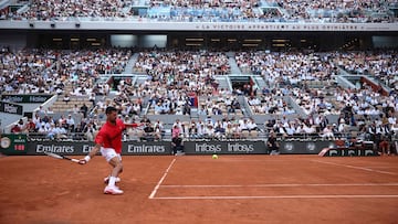 Serbia's Novak Djokovic plays a forehand return to Britain's Cameron Norrie during their men's singles match on day 9 of the French Open tennis tournament on Court Philippe-Chatrier at the Roland-Garros Complex in Paris on June 2, 2025. (Photo by Anne-Christine POUJOULAT / AFP)
