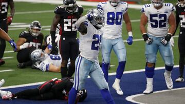 Dallas Cowboys running back Ezekiel Elliott (21) celebrates running the ball for a touchdown as Atlanta Falcons&#039; Keanu Neal (22) checks on injured teammate Damontae Kazee, bottom, in the first half of an NFL football game in Arlington, Texas, Sunday,