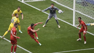 North Macedonia&#039;s goalkeeper Stole Dimitrievski, center, controls the ball during the Euro 2020 soccer championship group C match between Ukraine and North Macedonia at the National Arena stadium in Bucharest, Romania, Thursday, June 17, 2021. (AP Ph