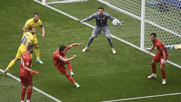 North Macedonia&#039;s goalkeeper Stole Dimitrievski, center, controls the ball during the Euro 2020 soccer championship group C match between Ukraine and North Macedonia at the National Arena stadium in Bucharest, Romania, Thursday, June 17, 2021. (AP Ph