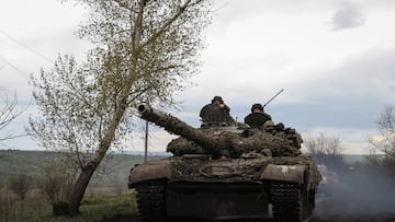 Ukrainian servicemen ride in a tank along a road in the town of Chasiv Yar, amid Russia's attack on Ukraine, near a front line in Donetsk region, Ukraine April 22, 2023. REUTERS/Sofiia Gatilova