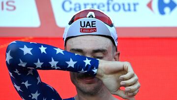 Team UAE's Brandon McNulty reacts on the podium after winning the stage 1 of La Vuelta a Espana cycling tour, a 12 km time-trial race from Lisbon to Oeiras, on August 17, 2024. (Photo by MIGUEL RIOPA / AFP)