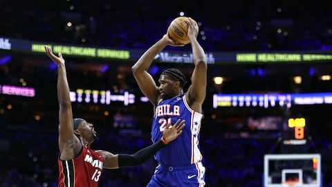 PHILADELPHIA, PENNSYLVANIA - APRIL 17: Bam Adebayo #13 of the Miami Heat guards Joel Embiid #21 of the Philadelphia 76ers during the first quarter of the Eastern Conference Play-In Tournament at the Wells Fargo Center on April 17, 2024 in Philadelphia, Pennsylvania. NOTE TO USER: User expressly acknowledges and agrees that, by downloading and or using this photograph, User is consenting to the terms and conditions of the Getty Images License Agreement.   Tim Nwachukwu/Getty Images/AFP (Photo by Tim Nwachukwu / GETTY IMAGES NORTH AMERICA / Getty Images via AFP)