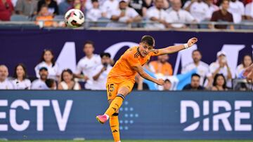 Jul 31, 2024; Chicago, IL, USA; Real Madrid midfielder Arda Guler (15) shoots the ball against AC Milan during the first half at Soldier Field. Mandatory Credit: Daniel Bartel-USA TODAY Sports
