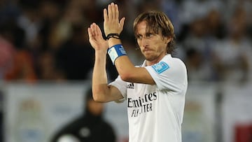 Real Madrid's Croatian midfielder Luka Modric greets the fans upon being substituted during the FIFA Club World Cup final football match between Spain's Real Madrid and Saudi Arabia's Al-Hilal at the Prince Moulay Abdellah Stadium in Rabat on February 11, 2023. (Photo by Fadel Senna / AFP)