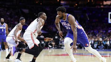 PHILADELPHIA, PENNSYLVANIA - FEBRUARY 27: Joel Embiid #21 of the Philadelphia 76ers drives past Bam Adebayo #13 of the Miami Heat during the first quarter at Wells Fargo Center on February 27, 2023 in Philadelphia, Pennsylvania. NOTE TO USER: User expressly acknowledges and agrees that, by downloading and or using this photograph, User is consenting to the terms and conditions of the Getty Images License Agreement.   Tim Nwachukwu/Getty Images/AFP (Photo by Tim Nwachukwu / GETTY IMAGES NORTH AMERICA / Getty Images via AFP)