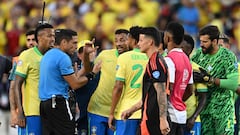 Brazil's defender #03 Eder Militao (L) and Brazil's midfielder #24 Ederson (C) alongside teammates argue with Venezuelan referee Jesus Valenzuela (2nd L) at the end of the Conmebol 2024 Copa America tournament group D football match between Brazil and Colombia at Levi's Stadium in Santa Clara, California on July 2, 2024. (Photo by Patrick T. Fallon / AFP)