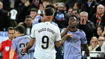 Real Madrid's Brazilian forward #07 Vinicius Junior argues with Valencia's Spanish forward #09 Hugo Duro during the Spanish league football match between Valencia CF and Real Madrid at the Mestalla stadium in Valencia on March 2, 2024 (Photo by JOSE JORDAN / AFP)