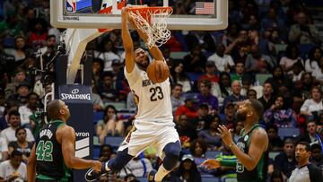 Mar 18, 2018; New Orleans, LA, USA; New Orleans Pelicans forward Anthony Davis (23) dunks over Boston Celtics forward Al Horford (42) and guard Kadeem Allen (45) during the second half at the Smoothie King Center. The Pelicans defeated the Celtics 108-89. Mandatory Credit: Derick E. Hingle-USA TODAY Sports