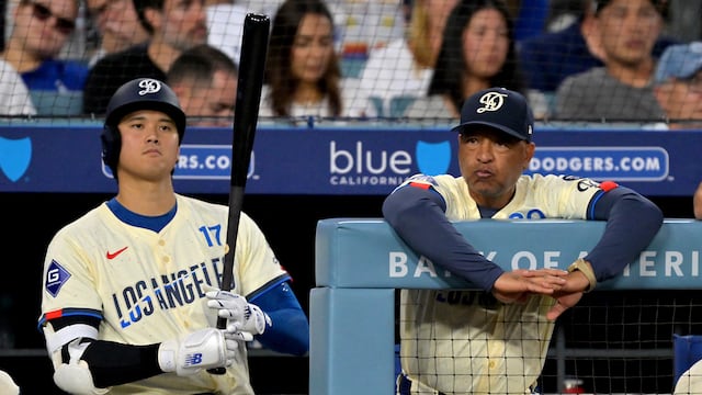 Aug 30, 2025; Los Angeles, California, USA; Los Angeles Dodgers designated hitter Shohei Ohtani (17) and manager Dave Roberts (30) look on from the dugout during the fifth inning against the Arizona Diamondbacks at Dodger Stadium. Mandatory Credit: Jayne Kamin-Oncea-Imagn Images