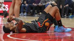 Oct 31, 2019; Atlanta, GA, USA; Atlanta Hawks forward John Collins (20) lays on the floor after being injured against the Miami Heat during the second half at State Farm Arena. Mandatory Credit: Dale Zanine-USA TODAY Sports