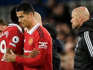 Manchester United's Dutch manager Erik ten Hag (R) watches as Manchester United's Portuguese striker Cristiano Ronaldo (C) is subbed on for Manchester United's French striker Anthony Martial (L) during the English Premier League football match between Everton and Manchester United at Goodison Park in Liverpool, north west England on October 9, 2022. - Manchester United said on November 18, 2022 the club have "initiated appropriate steps" following an explosive interview by Cristiano Ronaldo that left his future at Old Trafford in doubt. The five-time Ballon d'Or winner said he did not respect United manager Erik ten Hag and took aim at the club's owners, the Glazer family, during the 90-minute interview aired on TalkTV. (Photo by Oli SCARFF / AFP) / RESTRICTED TO EDITORIAL USE. No use with unauthorized audio, video, data, fixture lists, club/league logos or 'live' services. Online in-match use limited to 120 images. An additional 40 images may be used in extra time. No video emulation. Social media in-match use limited to 120 images. An additional 40 images may be used in extra time. No use in betting publications, games or single club/league/player publications. /