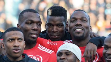 In this file photo taken on December 29, 2019, the Pogba brothers, Paul Pogba (C), Florentin Pogba (L) and Mathias Pogba (R), pose prior to a gala football match between All Star France and Guinea at the Vallee du Cher Stadium in Tours.