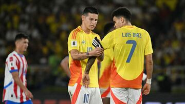 Colombia's midfielder #10 James Rodriguez (L) puts the captain's sash on Colombia's forward #07 Luis Diaz during the 2026 FIFA World Cup South American qualifiers football match between Colombia and Paraguay at the Metropolitano Roberto Melendez stadium in Barranquilla, Colombia, on March 25, 2025. (Photo by Luis ACOSTA / AFP) (Photo by LUIS ACOSTA/AFP via Getty Images)