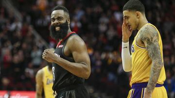 Jan 19, 2019; Houston, TX, USA; Houston Rockets guard James Harden (13) celebrates and Los Angeles Lakers forward Kyle Kuzma (0) reacts after a play during overtime at Toyota Center. Mandatory Credit: Troy Taormina-USA TODAY Sports