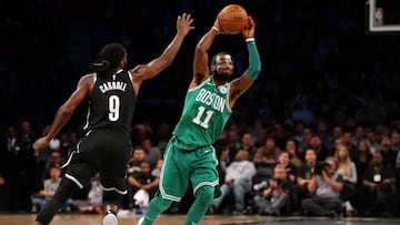 Nov 14, 2017; Brooklyn, NY, USA; Boston Celtics point guard Kyrie Irving (11) passes the ball away from Brooklyn Nets small forward DeMarre Carroll (9) during the fourth quarter at Barclays Center. Mandatory Credit: Brad Penner-USA TODAY Sports     TPX IMAGES OF THE DAY