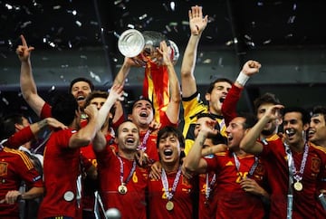 Xavi Hernandez (C) of Spain lifts the trophy as he celebrates with team-mates following victory in the UEFA EURO 2012 final match between Spain and Italy at the Olympic Stadium on July 1, 2012 in Kiev, Ukraine.