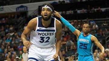 CHARLOTTE, NORTH CAROLINA - OCTOBER 25: Karl-Anthony Towns #32 of the Minnesota Timberwolves reacts alongside PJ Washington #25 of the Charlotte Hornets during their game at Spectrum Center on October 25, 2019 in Charlotte, North Carolina. NOTE TO USER: User expressly acknowledges and agrees that, by downloading and or using this photograph, User is consenting to the terms and conditions of the Getty Images License Agreement.   Streeter Lecka/Getty Images/AFP
 == FOR NEWSPAPERS, INTERNET, TELCOS &amp; TELEVISION USE ONLY ==