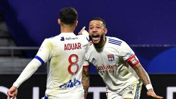 Lyon's French midfielder Houssem Aouar (L) celebrates with Lyon's Dutch forward Memphis Depay after scoring during the French L1 football match between Olympique Lyonnais and Stade Rennais Football Club at the Groupama Stadium in Decines-Charpie