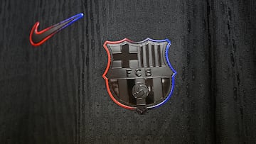 A detailed view of the Nike and the clubs logo on a shirt, which is displayed inside the FC Barcelona dressing room 