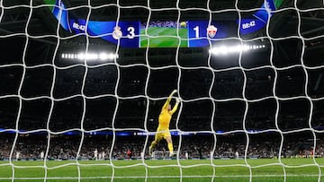 Elche's Argentine goalkeeper #01 Matias Dituro fails to stop a goal by Real Madrid's Turkish midfielder #15 Arda Guler during the Spanish league football match between Real Madrid CF and Elche CF at the Santiago Bernabeu Stadium in Madrid on March 14, 2026. (Photo by Oscar DEL POZO / AFP)