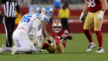 Dec 30, 2024; Santa Clara, California, USA; San Francisco 49ers quarterback Brock Purdy (13) is sacked by Detroit Lions safety Brian Branch (32) during the fourth quarter at Levi's Stadium. Mandatory Credit: Sergio Estrada-Imagn Images