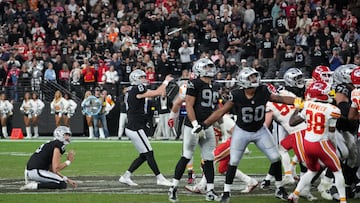 Jan 4, 2026; Paradise, Nevada, USA; Las Vegas Raiders place kicker Daniel Carlson (8) kicks a 60-yard field goal out of the hold of punter AJ Cole (6) with eight seconds left against the Kansas City Chiefs at Allegiant Stadium. Mandatory Credit: Kirby Lee-Imagn Images