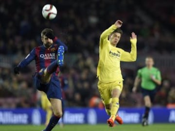 Gerard Pique y Luciano Vietto.