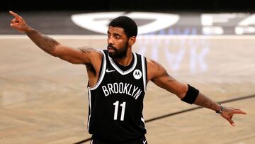 (FILES) In this file photo taken on December 31, 2020 Kyrie Irving #11 of the Brooklyn Nets points during the second half against the Atlanta Hawks at Barclays Center in the Brooklyn borough of New York City. The Hawks won 114-96. - Brooklyn Nets guard Kyrie Irving has been fined $50,000 by the NBA after attending a crowded indoor party without wearing a mask, the league said January 15, 2021.
Irving was placed under investigation after video emerged on social media showing him attending a birthday party with no mask. (Photo by Sarah Stier / GETTY IMAGES NORTH AMERICA / AFP)