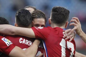 Torres celebrates his goal with his Atleti team-mates.