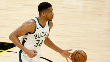 (FILES) In this file photo taken on February 10, 2021  Giannis Antetokounmpo #34 of the Milwaukee Bucks handles the ball during the NBA game against the Phoenix Suns at Phoenix Suns Arena in Phoenix, Arizona. - Two-time NBA Most Valuable Player Giannis Antetokounmpo, out with a hyperextended left knee, is improving but remains questionable for the Milwaukee Bucks in July 6, 2021 opening game of the NBA Finals. (Photo by Christian Petersen / GETTY IMAGES NORTH AMERICA / AFP)