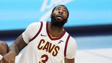 Denver Nuggets forward Paul Millsap, left, fights for position for a rebound with Cleveland Cavaliers center Andre Drummond in the second half of an NBA basketball game Wednesday, Feb. 10, 2021, in Denver. (AP Photo/David Zalubowski)