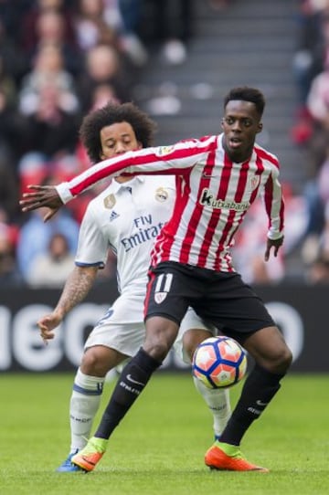 Iñaki Williams shields the ball from Marcelo.