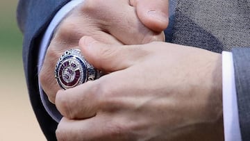 President Theo Epstein of the Chicago Cubs adjusts his World Series Championship ring