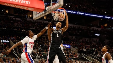 Victor Wembanyama #1 of the San Antonio Spurs dunks by Javonte Green #31 of the Detroit Pistons in the first half at Frost Bank Center on March 5, 2026 in San Antonio, Texas.