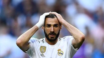 (FILES) In this file photo taken on October 1, 2019 Real Madrid's French forward Karim Benzema reacts during the UEFA Champions league Group A football match between Real Madrid and Club Brugge at the Santiago Bernabeu stadium in Madrid. - French foo