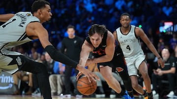 Dec 16, 2025; Las Vegas, Nevada, USA; New York Knicks guard Tyler Kolek (13) dribbles the ball past San Antonio Spurs forward Victor Wembanyama (1) in the second half during the Emirates NBA Cup Final at T-Mobile Arena. Mandatory Credit: Kirby Lee-Imagn Images