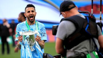 25 April 2021, United Kingdom, London: Manchester City&#039;s Riyad Mahrez celebrates with the trophy after winning the English Carabao Cup Final soccer match against Tottenham Hotspur at Wembley Stadium. Photo: Adam Davy/PA Wire/dpa
 25/04/2021 ONLY FOR 