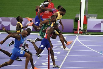 (Bottom to top) Italy's Lamont Marcell Jacobs, Botswana's Letsile Tebogo, US' Noah Lyles, Jamaica's Oblique Seville, South Africa's Akani Simbine, Jamaica's Kishane Thompson, US' Fred Kerley amd US' Kenneth Bednarek compete in the men's 100m final of the athletics event at the Paris 2024 Olympic Games at Stade de France in Saint-Denis, north of Paris, on August 4, 2024. (Photo by Dimitar DILKOFF / AFP)