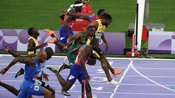 (Bottom to top) Italy's Lamont Marcell Jacobs, Botswana's Letsile Tebogo, US' Noah Lyles, Jamaica's Oblique Seville, South Africa's Akani Simbine, Jamaica's Kishane Thompson, US' Fred Kerley amd US' Kenneth Bednarek compete in the men's 100m final of the athletics event at the Paris 2024 Olympic Games at Stade de France in Saint-Denis, north of Paris, on August 4, 2024. (Photo by Dimitar DILKOFF / AFP)