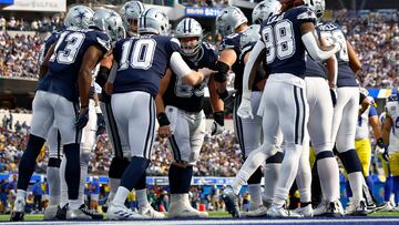 INGLEWOOD, CALIFORNIA - OCTOBER 09: Cooper Rush #10 of the Dallas Cowboys huddles the offense against the Los Angeles Rams during the second half at SoFi Stadium on October 09, 2022 in Inglewood, California. Ronald Martinez/Getty Images/AFP