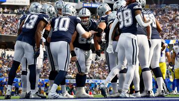 INGLEWOOD, CALIFORNIA - OCTOBER 09: Cooper Rush #10 of the Dallas Cowboys huddles the offense against the Los Angeles Rams during the second half at SoFi Stadium on October 09, 2022 in Inglewood, California.   Ronald Martinez/Getty Images/AFP