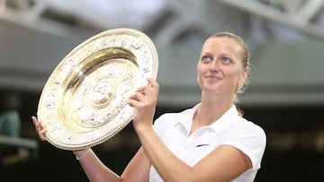 FILE PHOTO: Tennis - Wimbledon - All England Lawn Tennis & Croquet Club, Wimbledon, England - 5/7/14 Women's singles - Czech Republic's Petra Kvitova celebrates with the trophy after winning the final Mandatory Credit: Action Images / Henry Browne Livepic EDITORIAL USE ONLY./File Photo