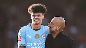 BOURNEMOUTH, ENGLAND - MARCH 30: Pep Guardiola, Manager of Manchester City, celebrates victory with Nico O'Reilly of Manchester City after the Emirates FA Cup Quarter Final match between AFC Bournemouth and Manchester City at Vitality Stadium on March 30, 2025 in Bournemouth, England. (Photo by Alex Pantling/Getty Images)