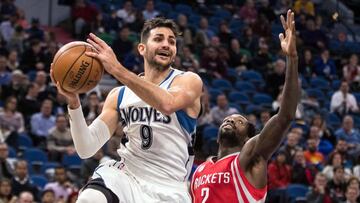 Jan 11, 2017; Minneapolis, MN, USA; Minnesota Timberwolves guard Ricky Rubio (9) passes around Houston Rockets guard Patrick Beverley (2) during the third quarter at Target Center. The Timberwolves defeated the Rockets 119-105. Mandatory Credit: Brace Hemmelgarn-USA TODAY Sports