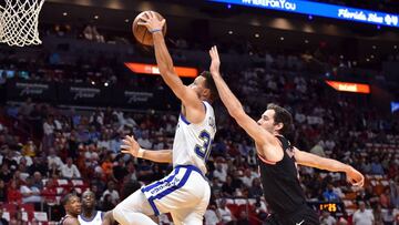 Dec 3, 2017; Miami, FL, USA; Golden State Warriors guard Stephen Curry (30) is fouled by Miami Heat guard Goran Dragic (7) during the first half at American Airlines Arena. Mandatory Credit: Steve Mitchell-USA TODAY Sports