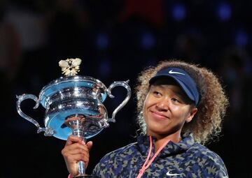 Japan's Naomi Osaka celebrates with the .Australian Open trophy after beating Jennifer Brady of the U.S in the women's singles final