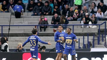 Pumas' Colombian defender #77 Alvaro Angulo (R) celebrates with teammates after scoring his team's second goal during the Liga MX Clausura match between Pumas and Monterrey at Olimpico Universitario Stadium in Mexico City on February 22, 2026. (Photo by Victor CRUZ / AFP)