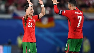 Portugal's forward #07 Cristiano Ronaldo and second goal-scorer,  Portugal's forward #26 Francisco Conceicao celebrate on the pitch after the UEFA Euro 2024 Group F football match between Portugal and the Czech Republic at the Leipzig Stadium in Leipzig on June 18, 2024. (Photo by PATRICIA DE MELO MOREIRA / AFP)
